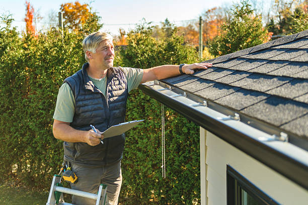 Professional Roofing technician working in Greene, IA